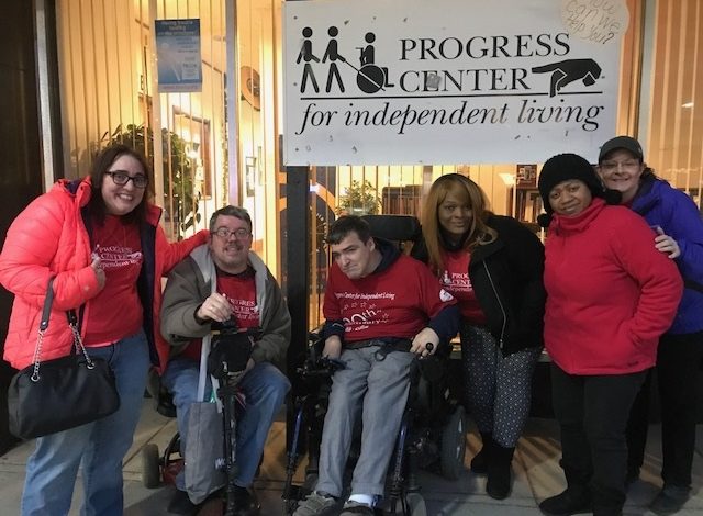 Image of members of the Progress Center Community outside of Progress Center's Office in Forest Park