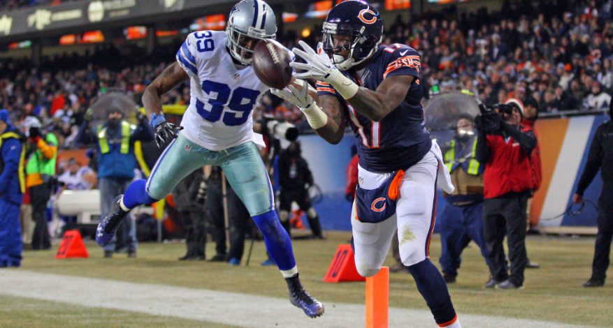 image from a Bears Cowboys Game in 2014. Bears receiver appears to be catching ball in end zone while defended by Cowboy player