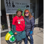 Carol pictured here on the right with coworker Esther during the St. Patrick's Day parade.